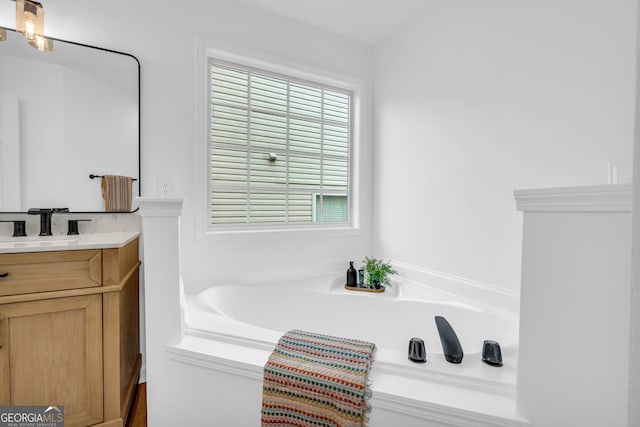 bathroom with vanity and a bathing tub