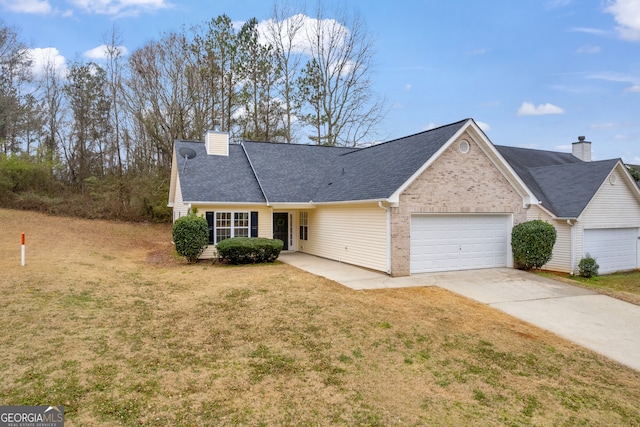 view of front of house with a garage and a front yard