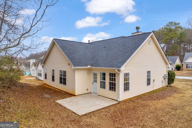 rear view of property featuring a patio area