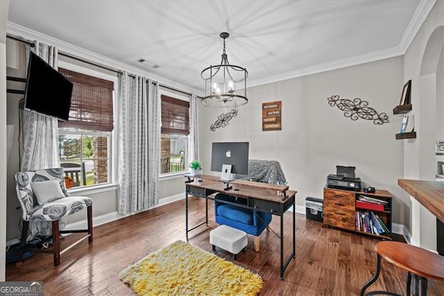 office space featuring a notable chandelier, wood-type flooring, and ornamental molding