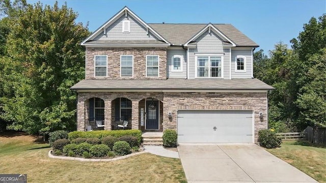 craftsman-style home featuring a garage and a front lawn