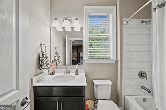 full bathroom with vanity, toilet, and shower / tub combo