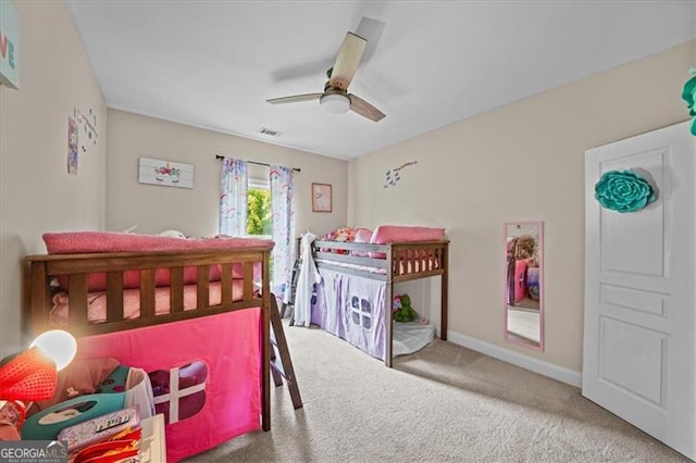 bedroom with ceiling fan and carpet flooring