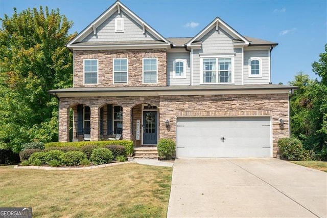 view of front of home featuring a garage, a porch, and a front yard