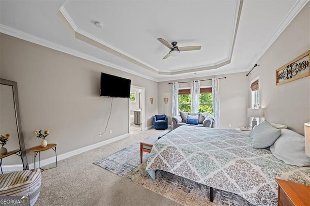 bedroom with a raised ceiling, crown molding, carpet, and ceiling fan