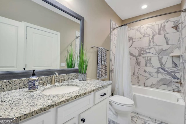 full bathroom featuring vanity, shower / bath combination with curtain, and toilet