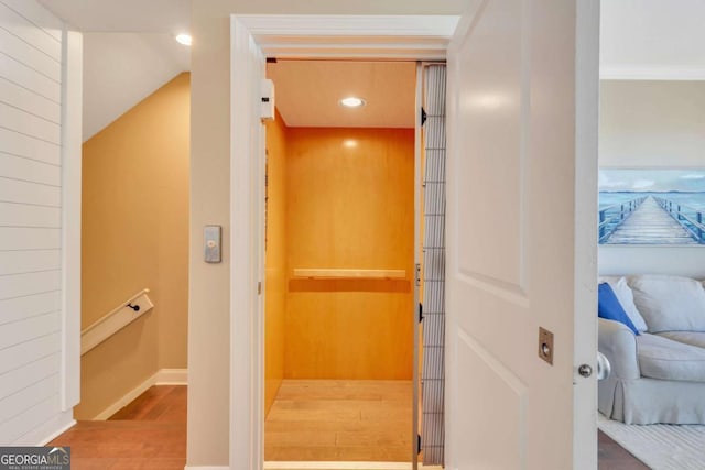 interior space featuring hardwood / wood-style flooring and elevator