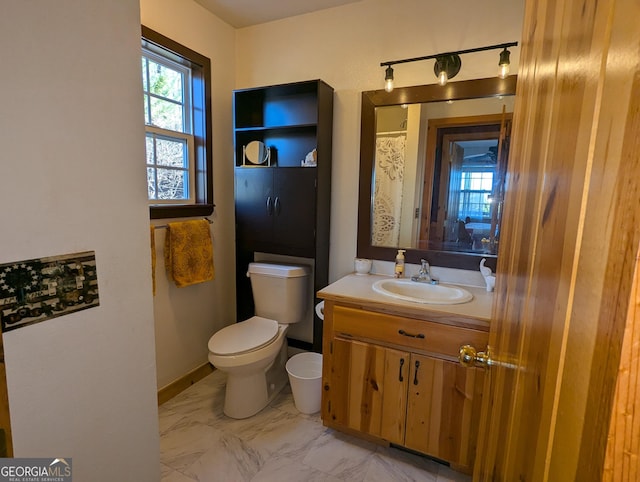 bathroom featuring vanity and toilet