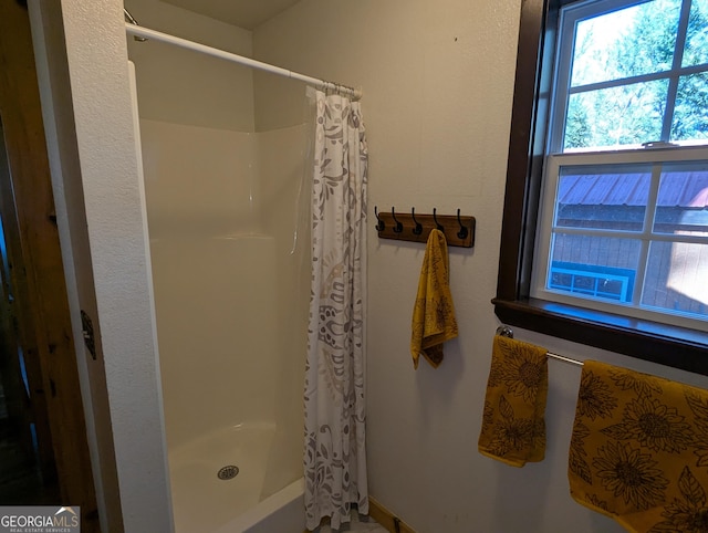 bathroom with a shower with shower curtain