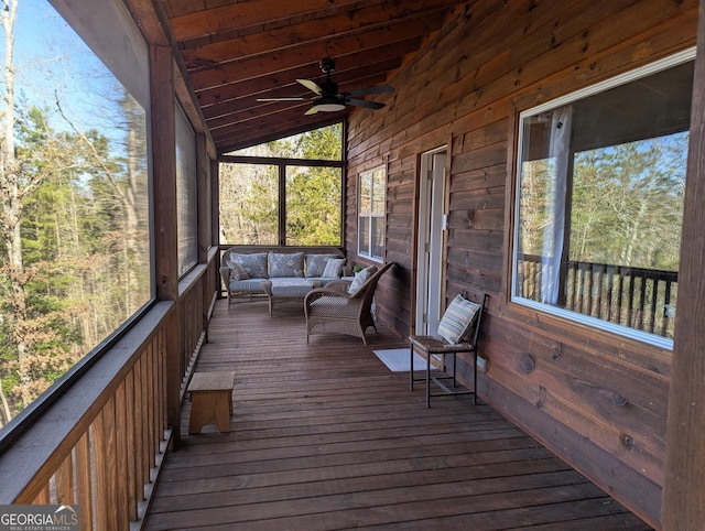 unfurnished sunroom with wood ceiling, ceiling fan, and vaulted ceiling