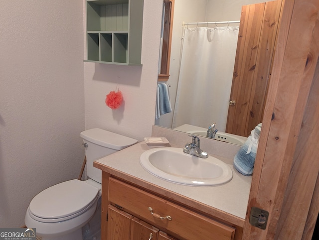 bathroom with vanity and toilet