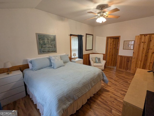 bedroom featuring dark wood-type flooring, ceiling fan, and lofted ceiling