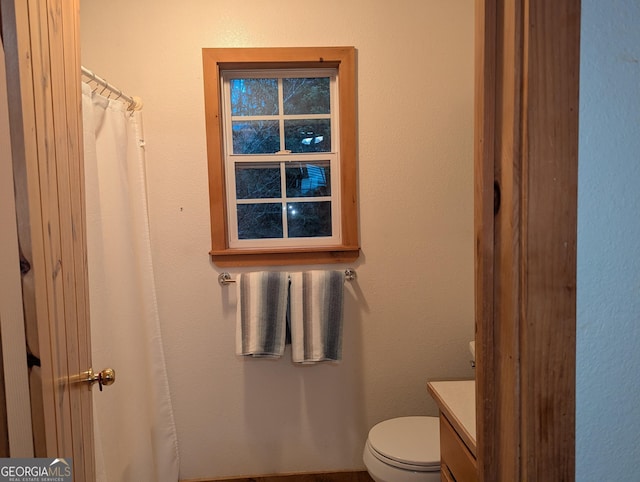 bathroom featuring vanity and toilet