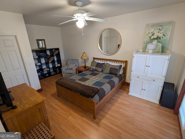 bedroom with ceiling fan and light hardwood / wood-style flooring