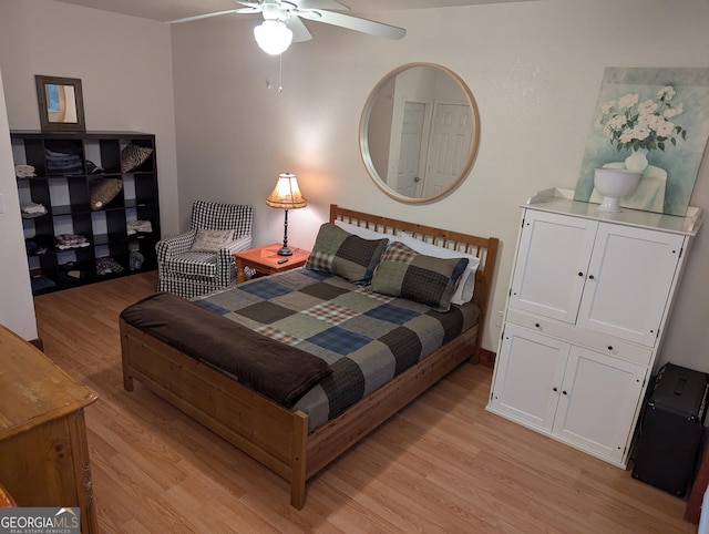 bedroom with ceiling fan and light hardwood / wood-style floors