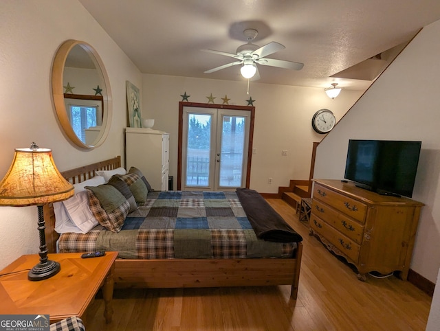 bedroom with french doors, ceiling fan, light wood-type flooring, and access to outside