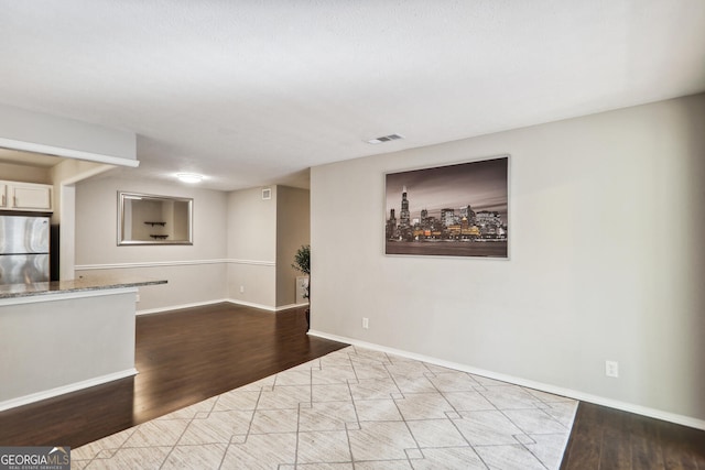 unfurnished living room featuring light hardwood / wood-style floors