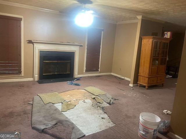 unfurnished living room with ornamental molding and a textured ceiling