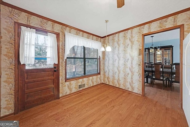 interior space with crown molding and wood-type flooring