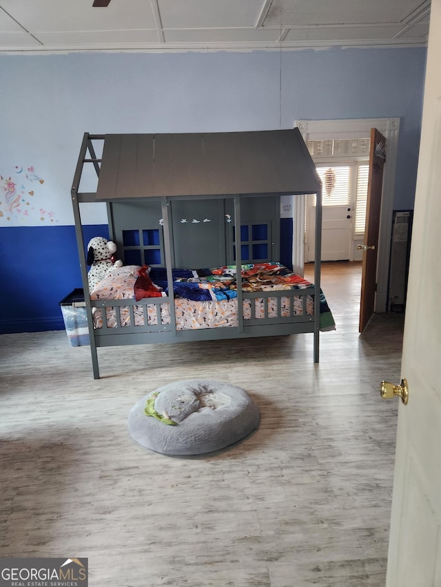 bedroom with hardwood / wood-style flooring