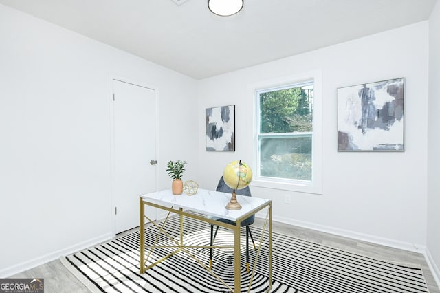 office area with wood-type flooring