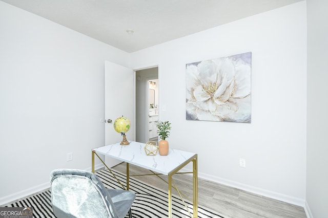 office space with light hardwood / wood-style flooring