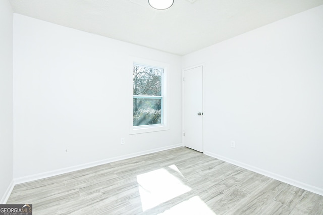 unfurnished room featuring light hardwood / wood-style floors