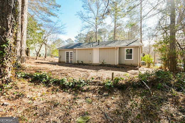 rear view of property with french doors