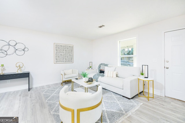 living room with light hardwood / wood-style floors