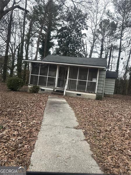 view of front of property with a sunroom