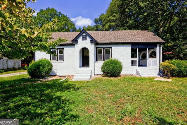 ranch-style house with a front lawn