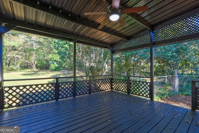 wooden terrace featuring ceiling fan