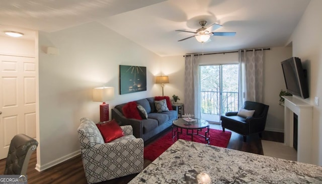 living room with vaulted ceiling, dark wood-type flooring, and ceiling fan