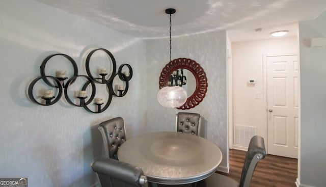 dining space featuring dark hardwood / wood-style flooring