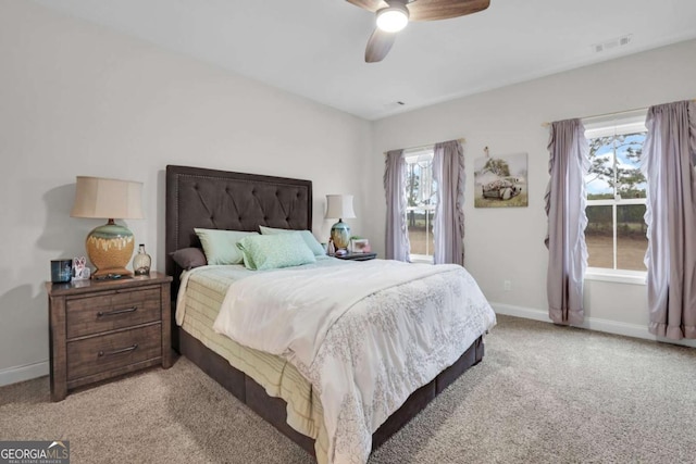 bedroom featuring light carpet and ceiling fan