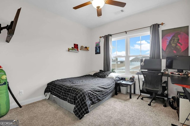 bedroom featuring light carpet and ceiling fan