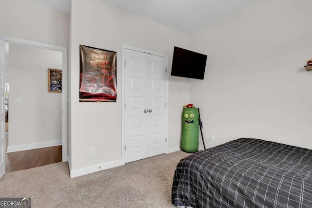 bedroom featuring a closet and carpet flooring