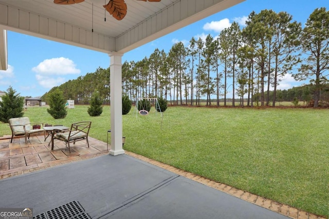 view of patio featuring ceiling fan