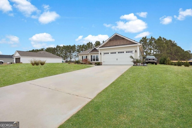 view of front of home with a garage and a front yard