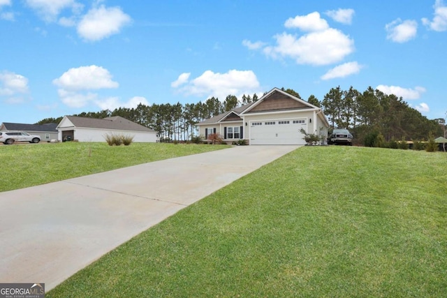 view of front of home featuring a garage and a front yard