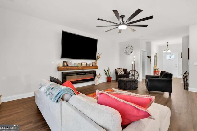 living room with dark hardwood / wood-style flooring