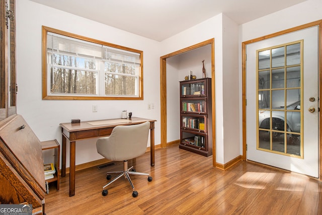 office area with light hardwood / wood-style floors