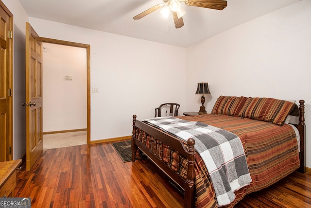 bedroom featuring dark hardwood / wood-style flooring and ceiling fan