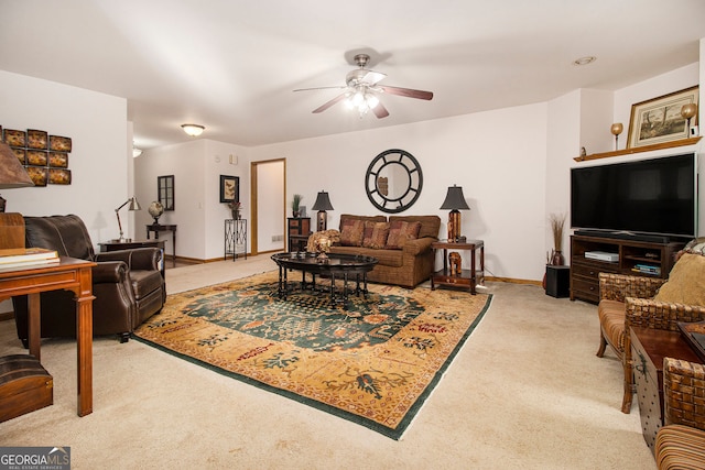 carpeted living room featuring ceiling fan