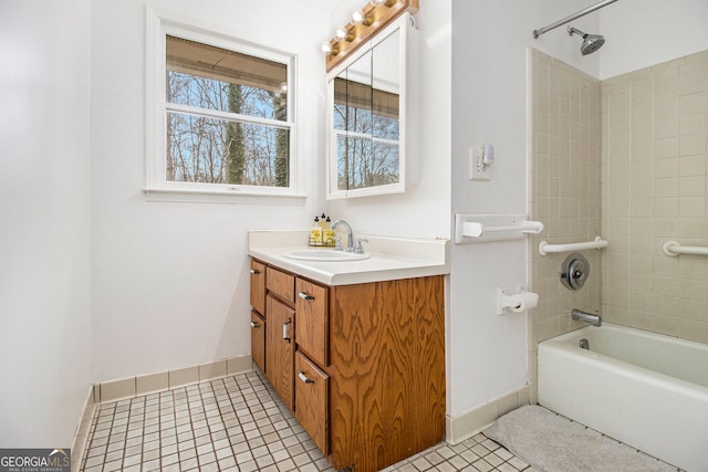 bathroom featuring vanity, tile patterned floors, and tiled shower / bath