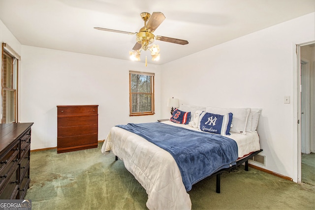 carpeted bedroom featuring ceiling fan