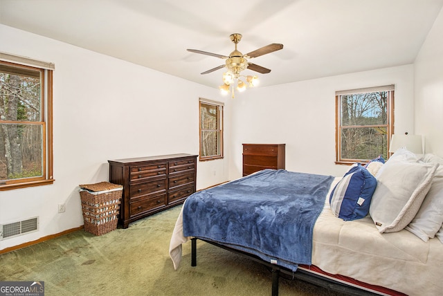 carpeted bedroom with ceiling fan