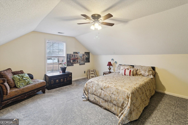 carpeted bedroom with ceiling fan, lofted ceiling, and a textured ceiling