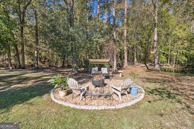 view of yard featuring a fire pit