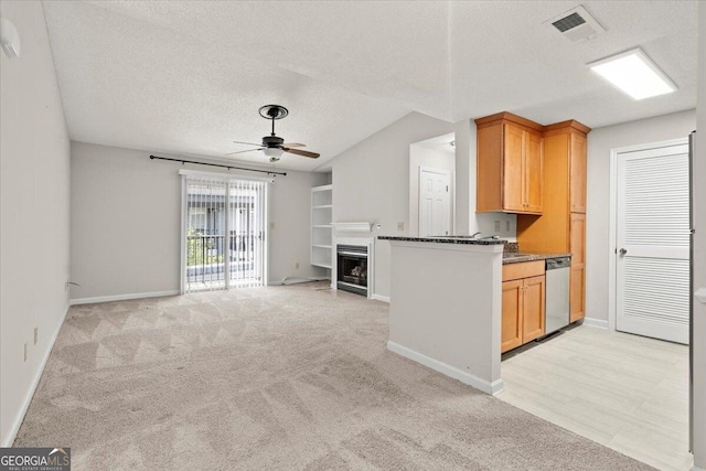 kitchen featuring dishwasher, wine cooler, ceiling fan, light carpet, and a textured ceiling